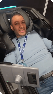 Customer trying a Costway massage chair